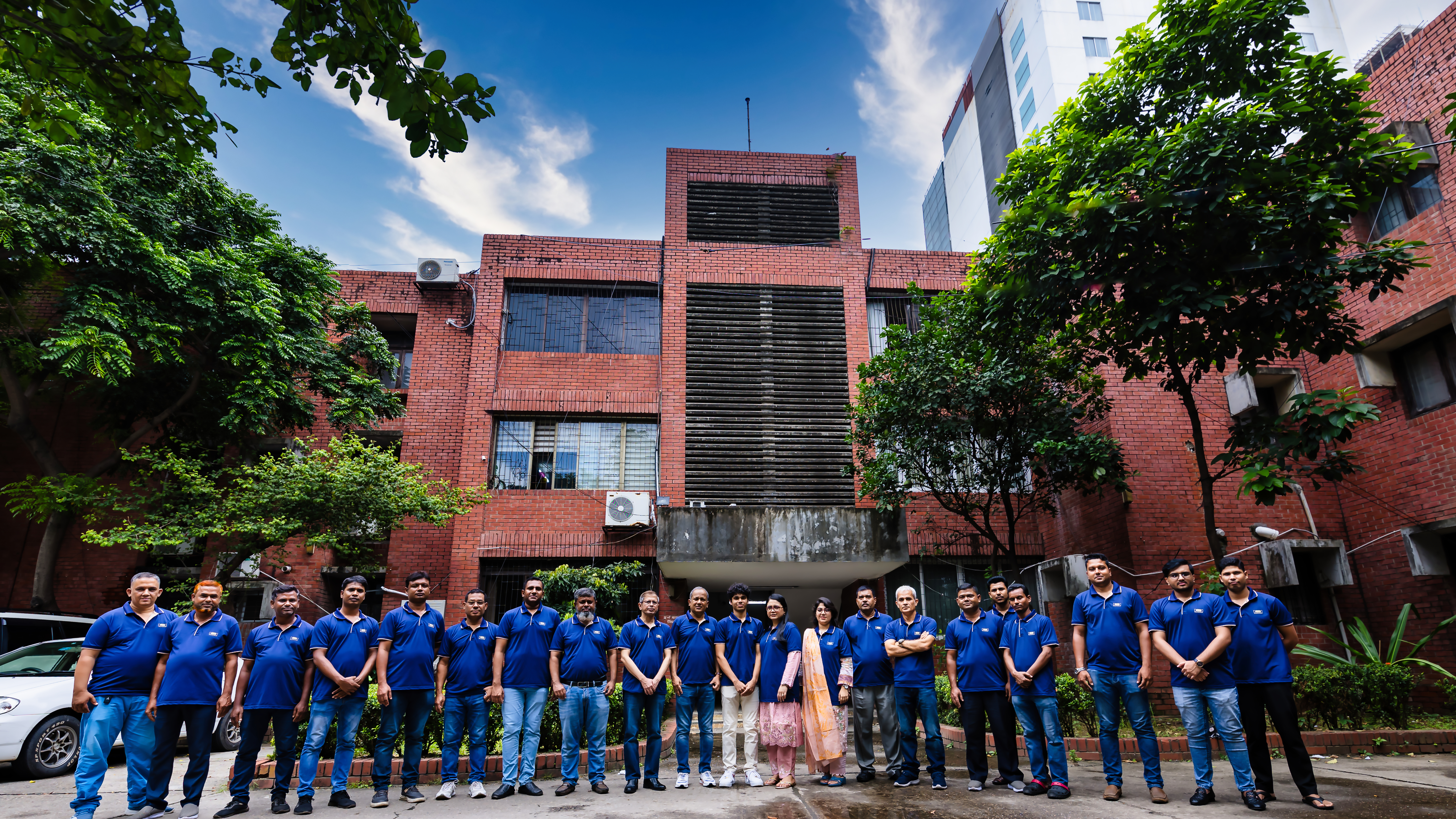 The Green Power team outside the Banani head office